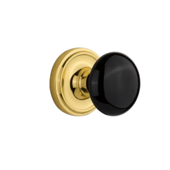 Classic Rosette With Black Porcelain Knob In Polished Brass