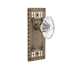 Craftsman Long Plate With Oval Fluted Crystal Knob In Antique Brass